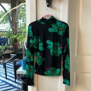 Never worn “net” turtleneck. Designer is unknown as there are no tags in the top